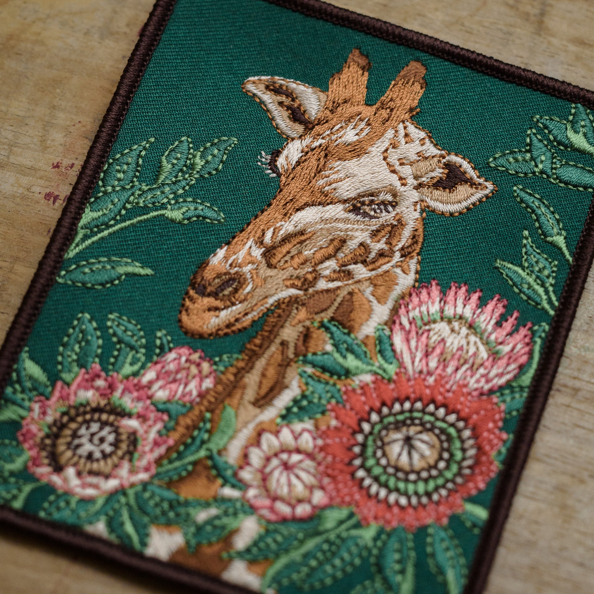 Detail of Giraffe and Protea Flower Embroidered Patch from WildloreFromArcana