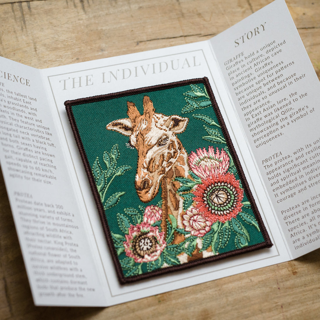 Giraffe and Protea Flower Embroidered Patch in gatefold card with science and story behind the species