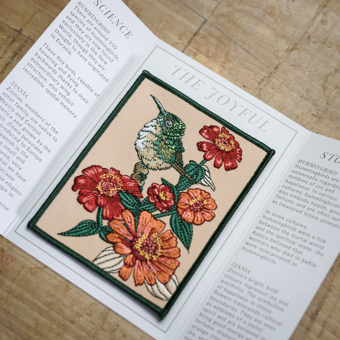 Hummingbird and Zinnia Embroidered Patch in gatefold card with science and story behind the species