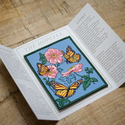 Monarch butterfly and Anemone flower Embroidered Patch in gatefold card with science and story behind the species