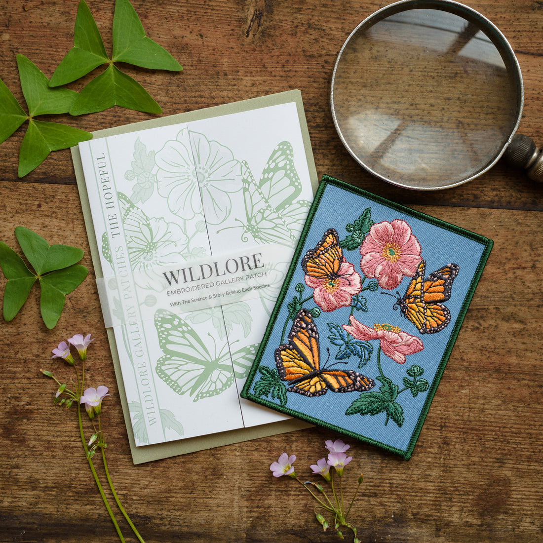 Monarch butterfly and Anemone flower Embroidered Patch in gatefold card with science and story behind the species