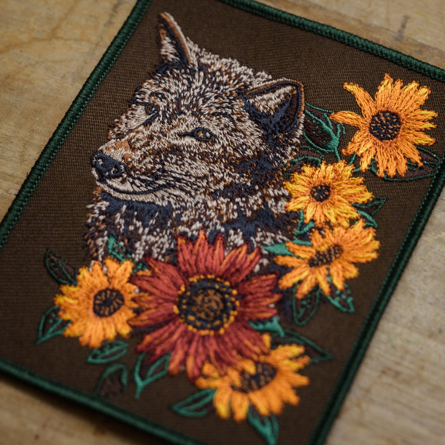 Detail of Grey Wolf and Sunflower Embroidered Patch from WildloreFromArcana